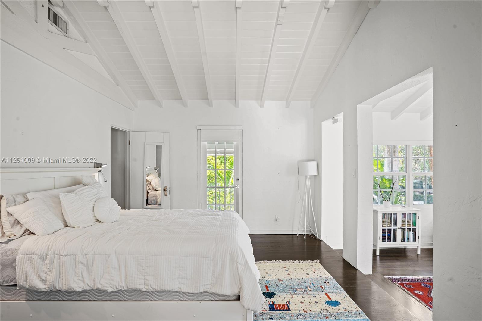 1701 Micanopy Avenue Miami, FL 33133 - Photo 32 of 46 a bedroom with a bed and a window