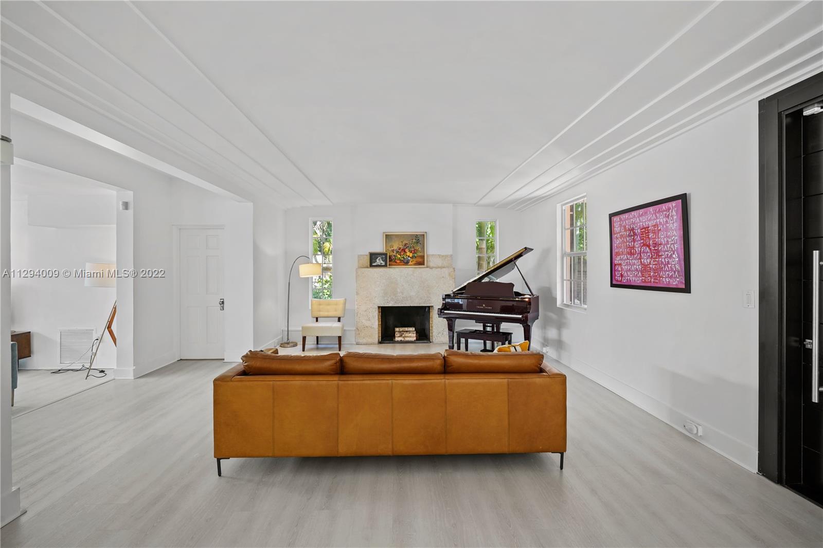 1701 Micanopy Avenue Miami, FL 33133 - Photo 4 of 46 a living room with furniture and wooden floor