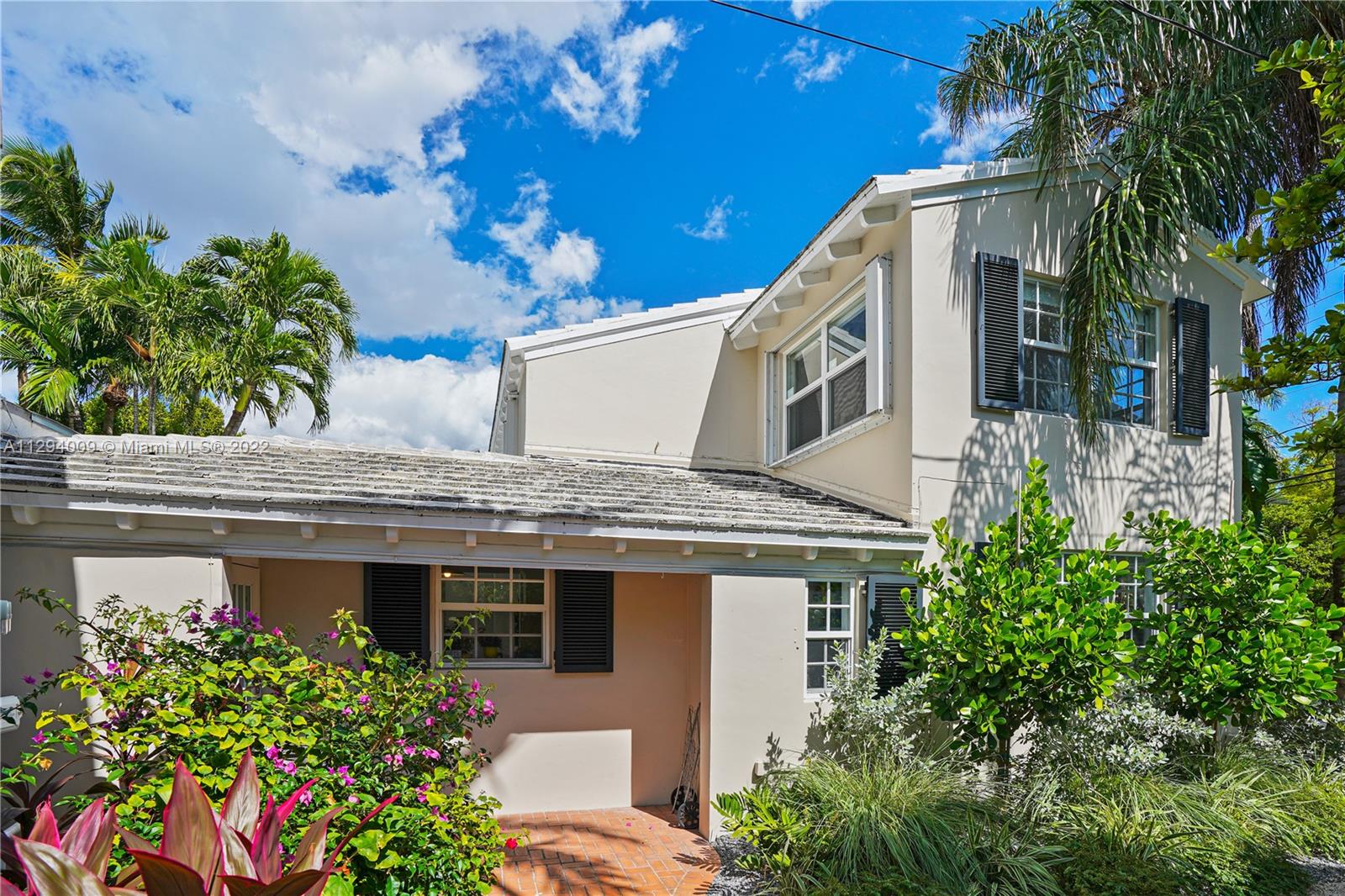 1701 Micanopy Avenue Miami, FL 33133 - Photo 41 of 46 a front view of a house with a yard
