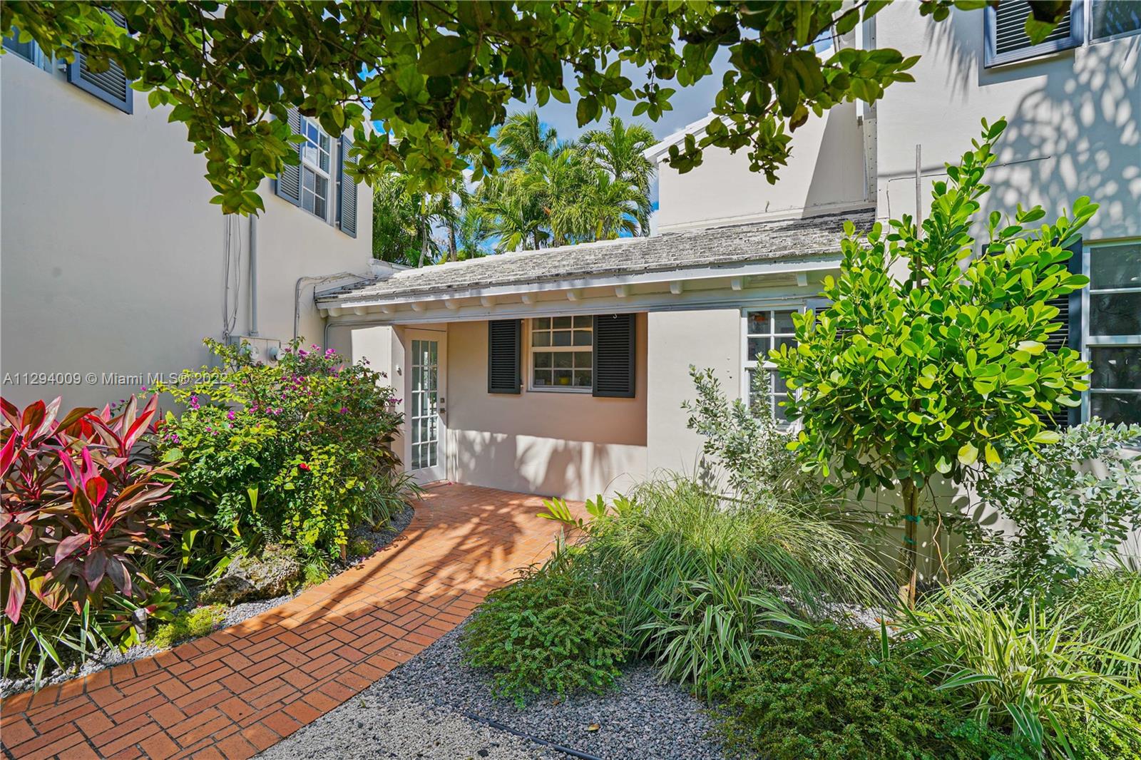 1701 Micanopy Avenue Miami, FL 33133 - Photo 42 of 46 a front view of a house with garden