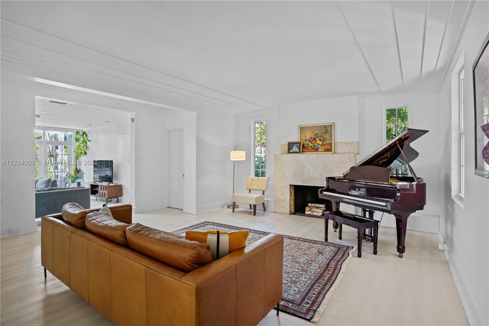 1701 Micanopy Avenue Miami, FL 33133 - Photo 5 of 46 a living room with furniture and a piano