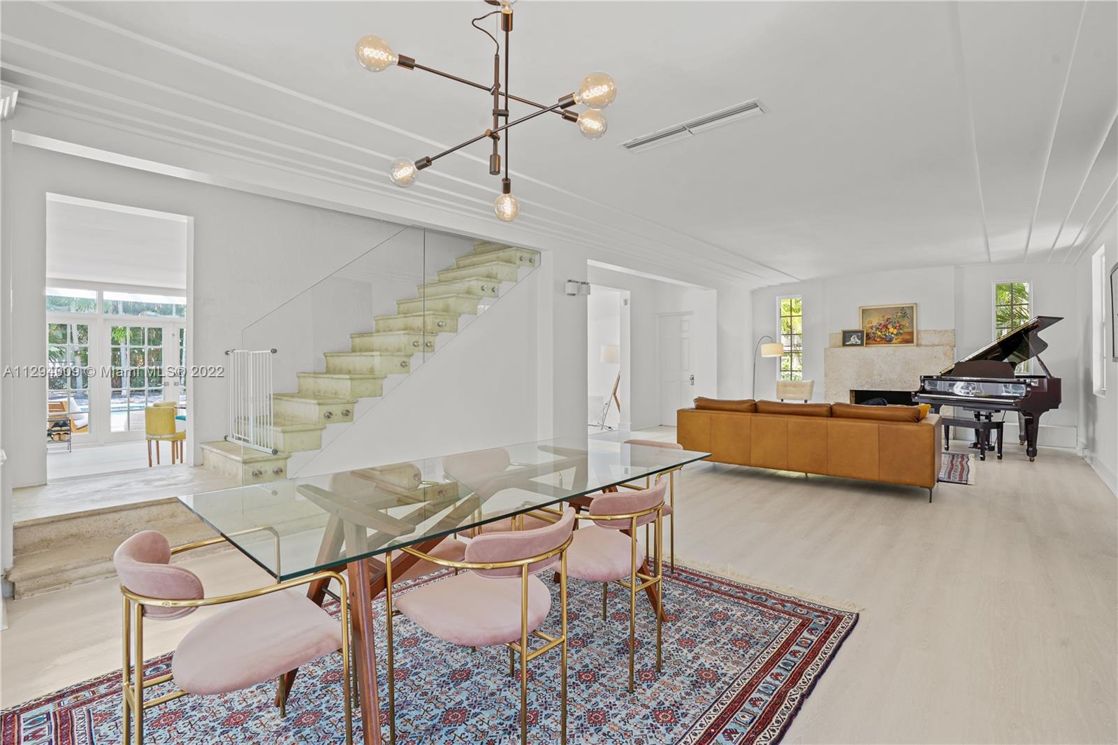 1701 Micanopy Avenue Miami, FL 33133 - Photo 6 of 46 a living room with furniture and wooden floor