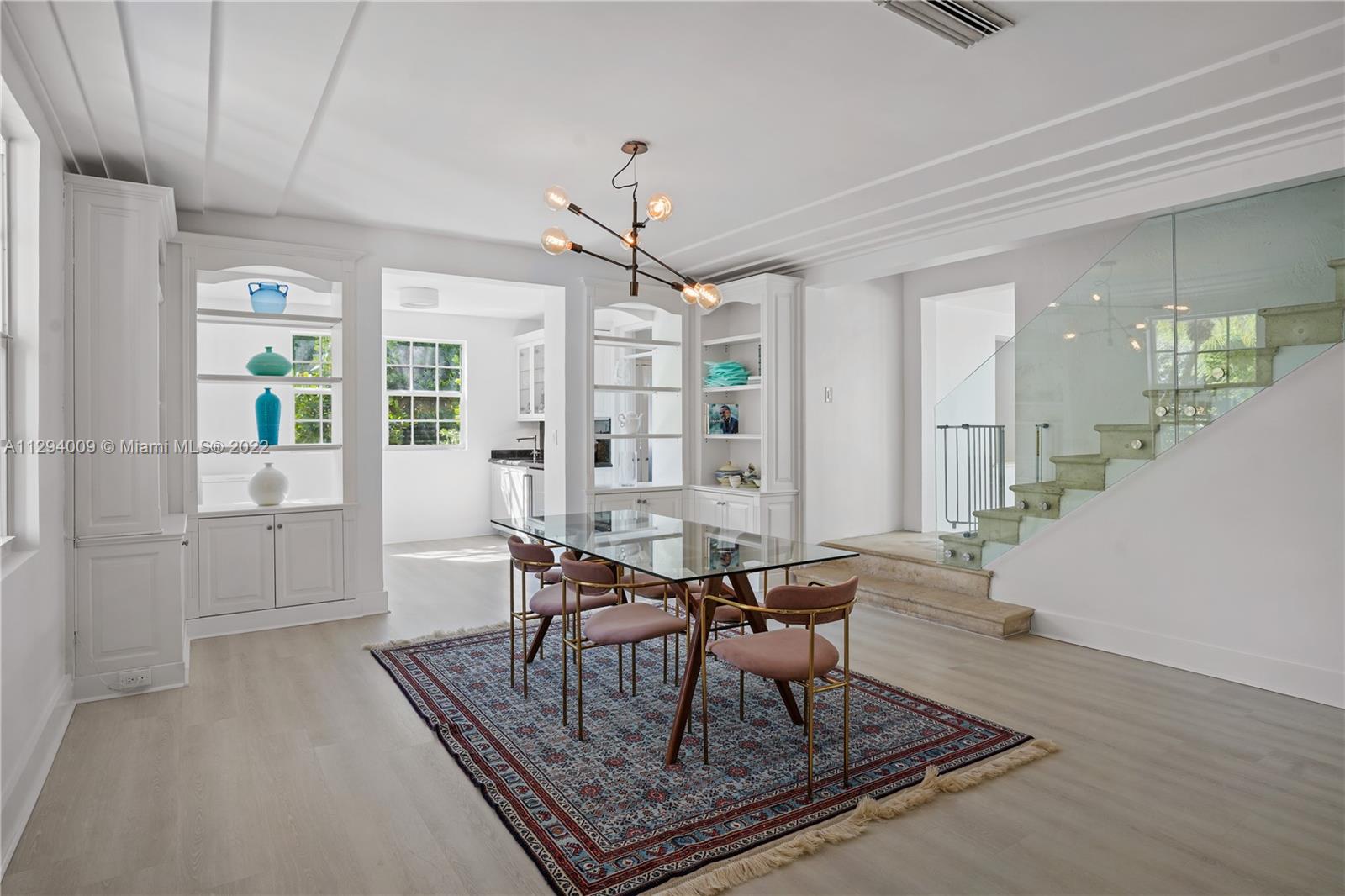 1701 Micanopy Avenue Miami, FL 33133 - Photo 8 of 46 a living room with furniture and a table