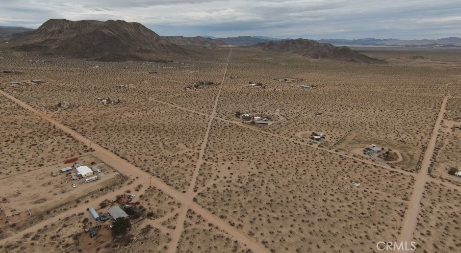 60426 Lorraine Road Landers, CA 92285 - Photo 1 of 23 a view of a dry yard with mountain
