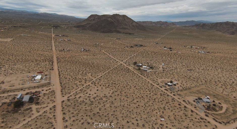 60426 Lorraine Road Landers, CA 92285 - Photo 19 of 23 a view of a dry yard with wooden fence