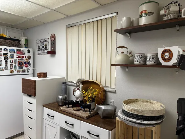 a kitchen with a stove and a refrigerator