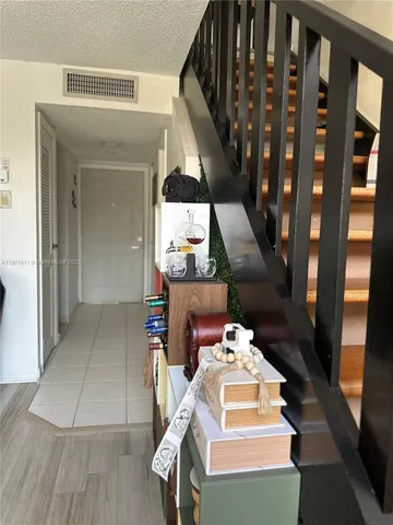 a view of entryway with wooden floor