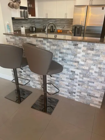 a living room with a flat screen tv and a fireplace