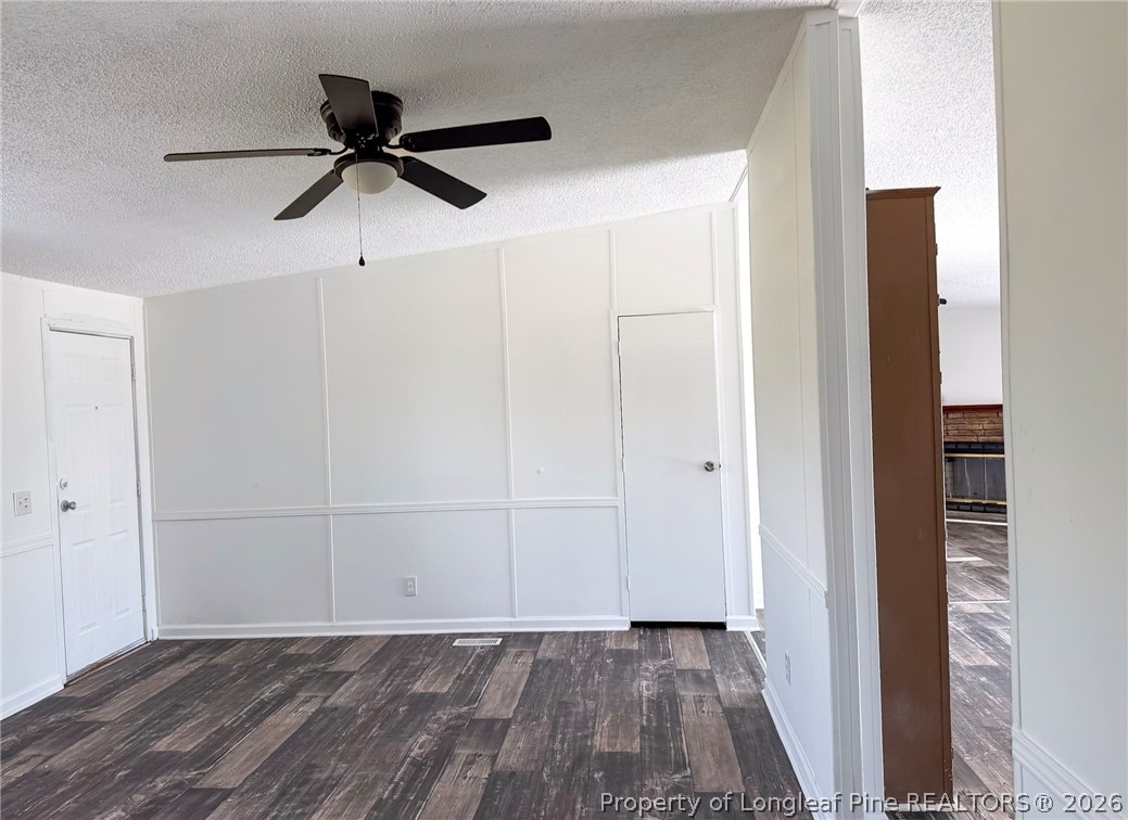 898 Brisson Road St. Pauls, NC 28384 - Photo 4 of 18 a view of a room with a ceiling fan and hardwood floor