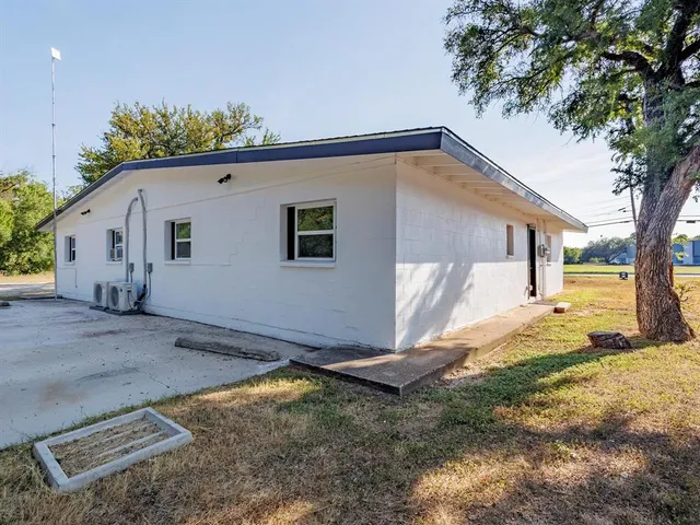 a house view with a backyard space