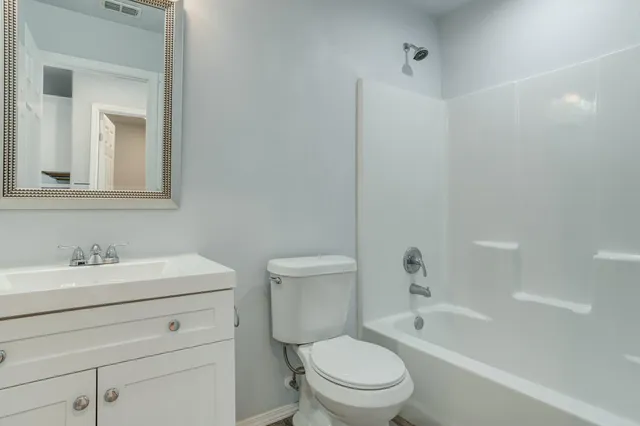 a bathroom with a toilet a sink and a bathtub