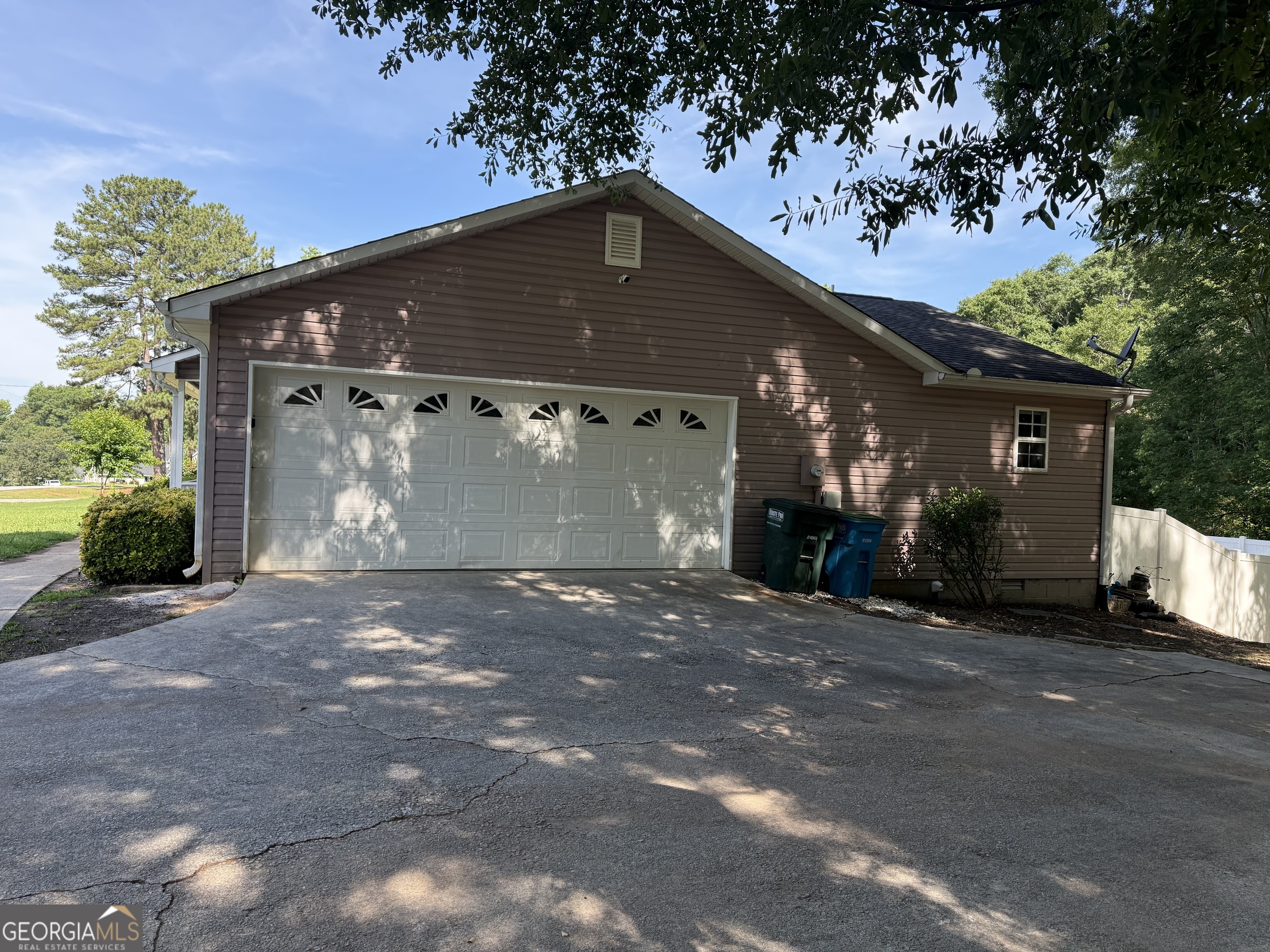 384 Sam Brown Boulevard Commerce, GA 30529 - Photo 23 of 25 a front view of a house with a yard and garage