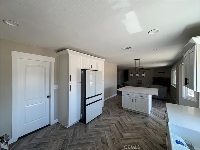 a kitchen with a refrigerator a sink and dishwasher