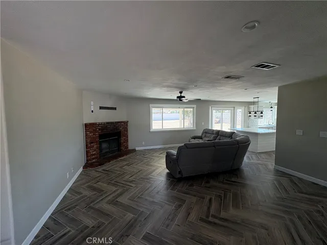a living room with furniture windows and a fireplace