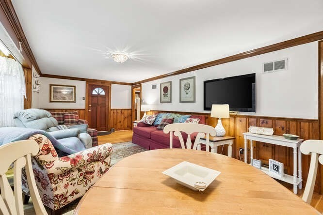 115 Quinn Road Lynn, MA 01904 - Photo 12 of 38 a living room with furniture window and a flat screen tv