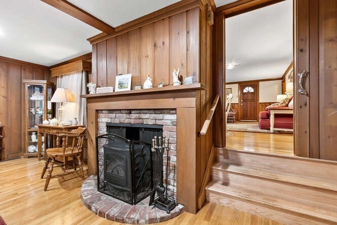 115 Quinn Road Lynn, MA 01904 - Photo 15 of 38 a living room with furniture and a fireplace