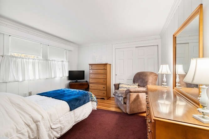 115 Quinn Road Lynn, MA 01904 - Photo 22 of 38 a bedroom with furniture and a window