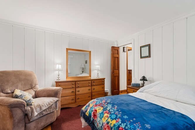 115 Quinn Road Lynn, MA 01904 - Photo 24 of 38 a bedroom with a bed and a dresser