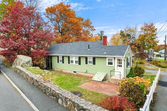 115 Quinn Road Lynn, MA 01904 - Photo 30 of 38 a front view of a house with a garden and plants