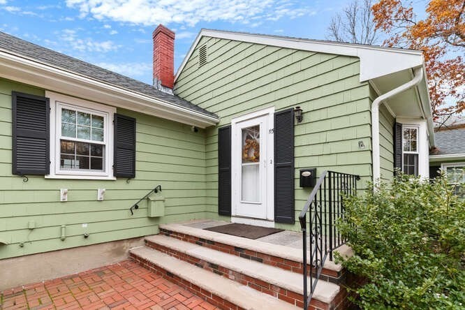 115 Quinn Road Lynn, MA 01904 - Photo 36 of 38 a front view of a house with a garden