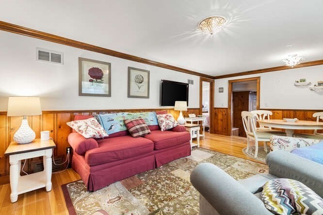 115 Quinn Road Lynn, MA 01904 - Photo 10 of 38 a living room with furniture and a flat screen tv