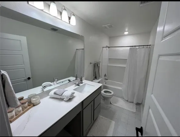 a bedroom with a bed and cabinet