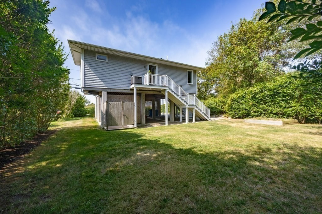 91 Balsam Street Fairhaven, MA 02719 - Photo 12 of 39 a front view of house with yard and green space