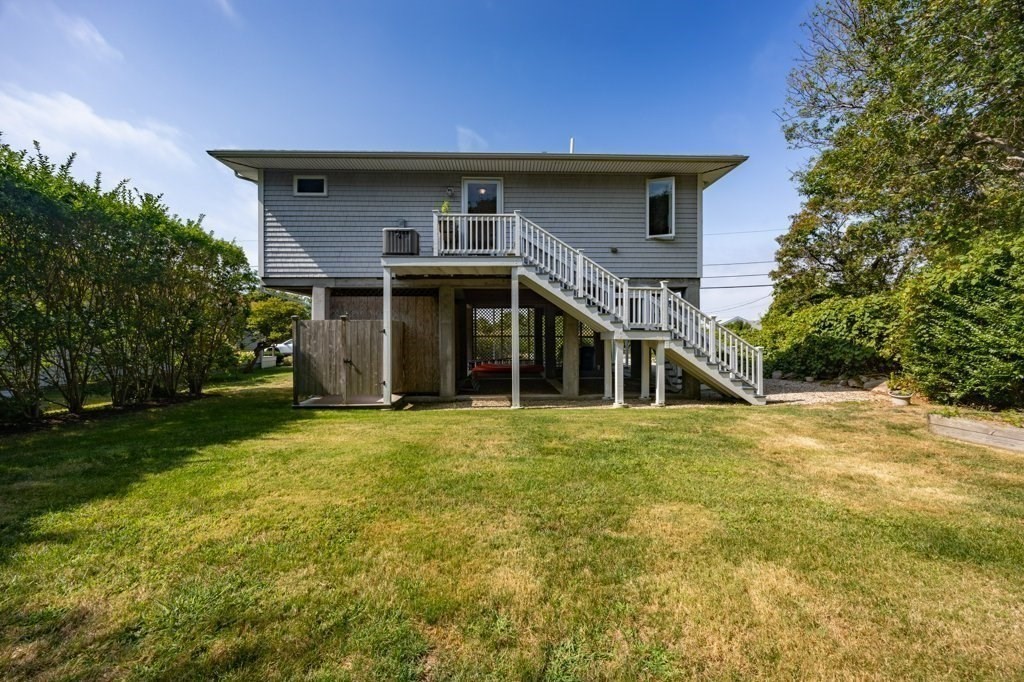 91 Balsam Street Fairhaven, MA 02719 - Photo 13 of 39 a front view of a house with a garden