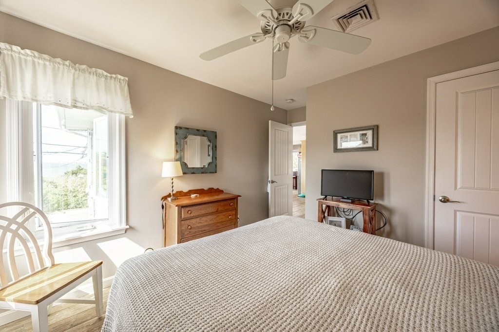 91 Balsam Street Fairhaven, MA 02719 - Photo 28 of 39 a bedroom with a bed and a flat screen tv