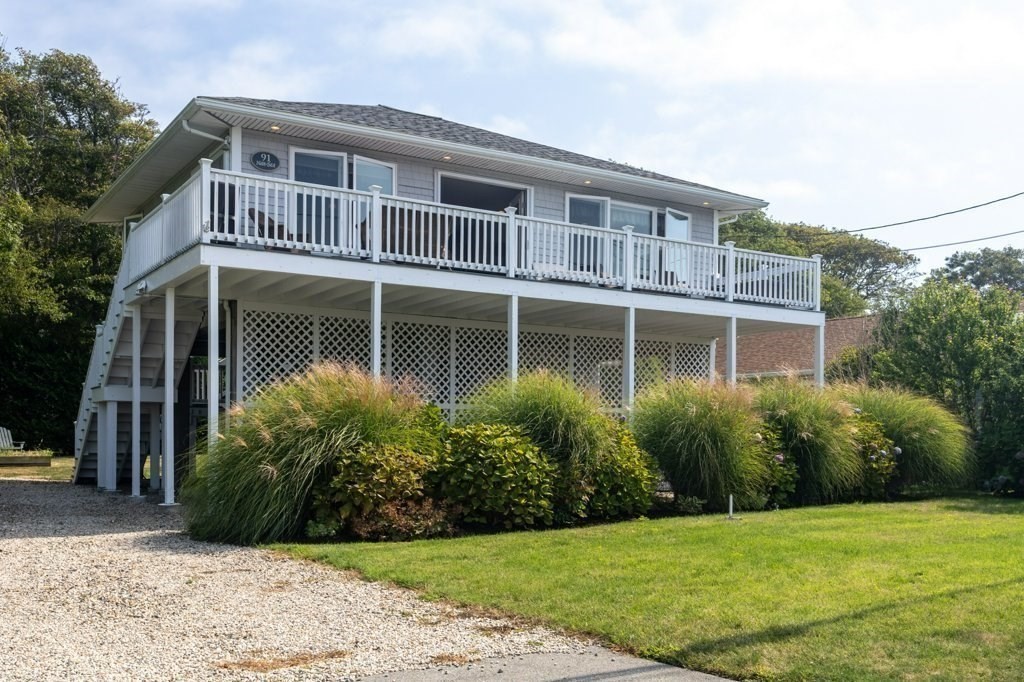 91 Balsam Street Fairhaven, MA 02719 - Photo 7 of 39 a front view of a house with a yard