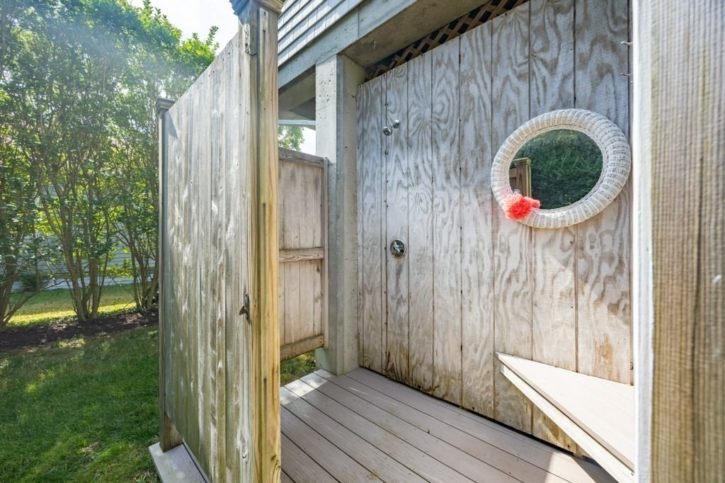 91 Balsam Street Fairhaven, MA 02719 - Photo 10 of 39 a view of a wooden door and a yard