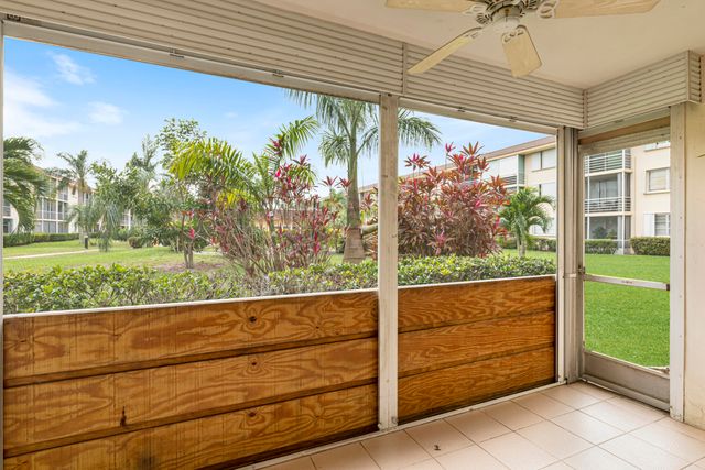 a view of a porch and a yard