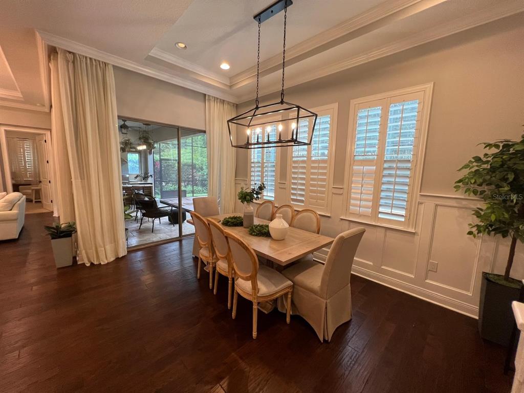 12927 Canopy Woods Way Winter Garden, FL 34787 - Photo 11 of 41 a dining room with furniture window wooden floor