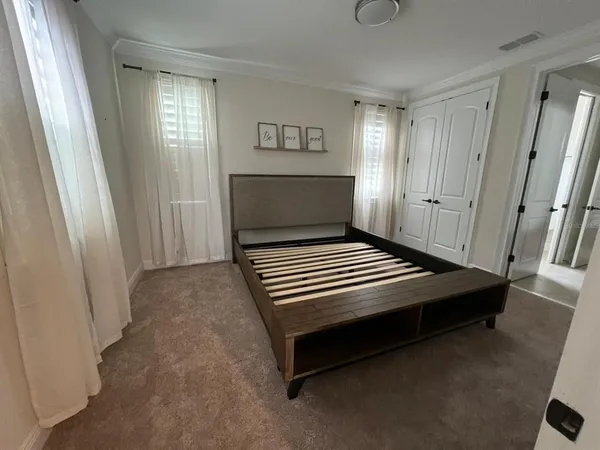 a view of a room with wooden floor and window