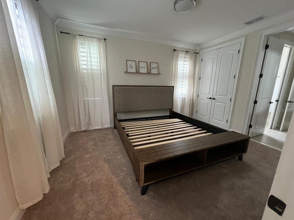12927 Canopy Woods Way Winter Garden, FL 34787 - Photo 24 of 41 a view of a room with wooden floor and window
