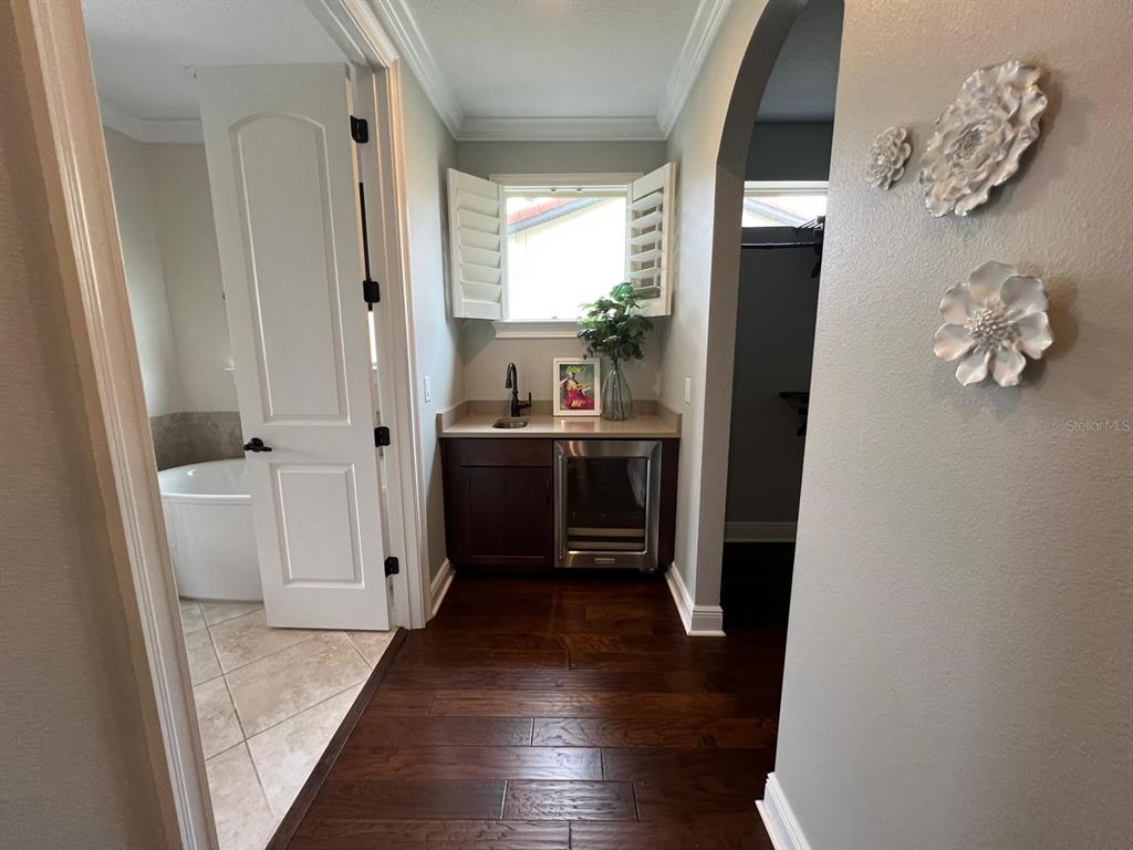 12927 Canopy Woods Way Winter Garden, FL 34787 - Photo 32 of 41 a view of a hallway view with wooden floor and electronic appliances