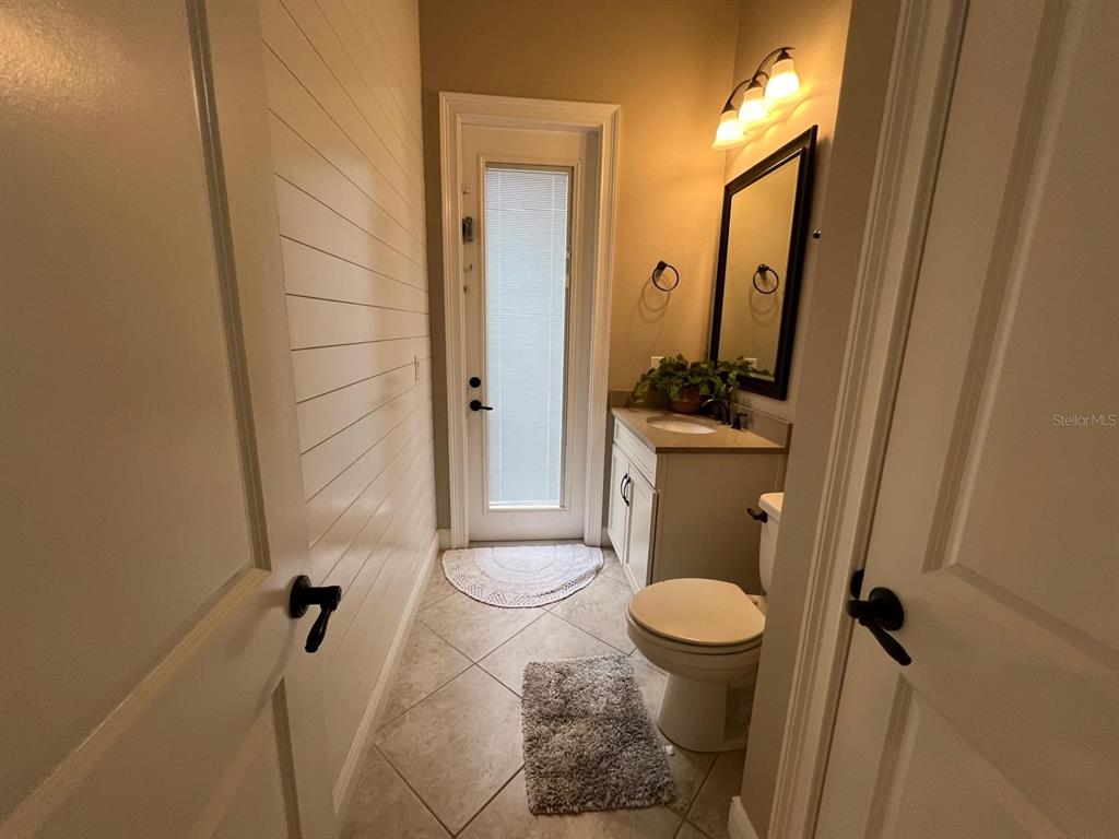 12927 Canopy Woods Way Winter Garden, FL 34787 - Photo 38 of 41 a bathroom with a granite countertop sink toilet and shower