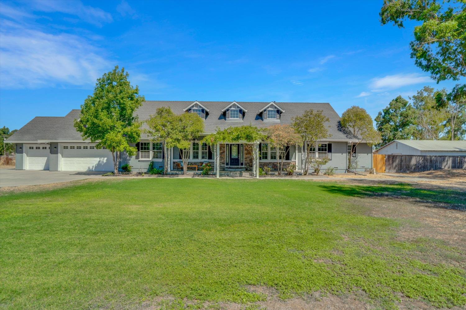 21987 Copperopolis Road Linden, CA 95236 - Photo 1 of 1 a view of a house with garden and a yard