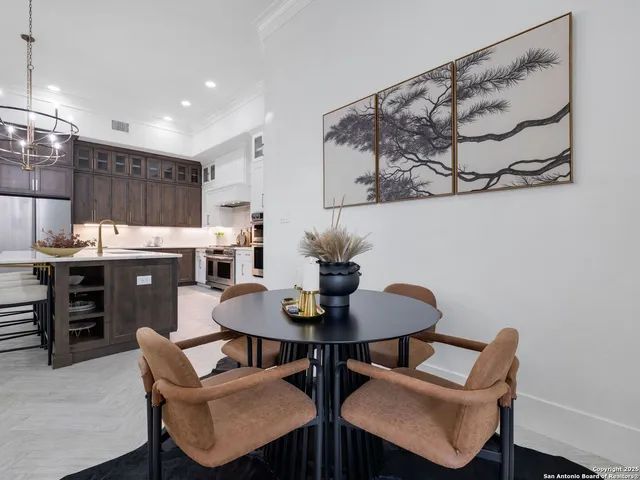 a dining room with furniture and wooden floor