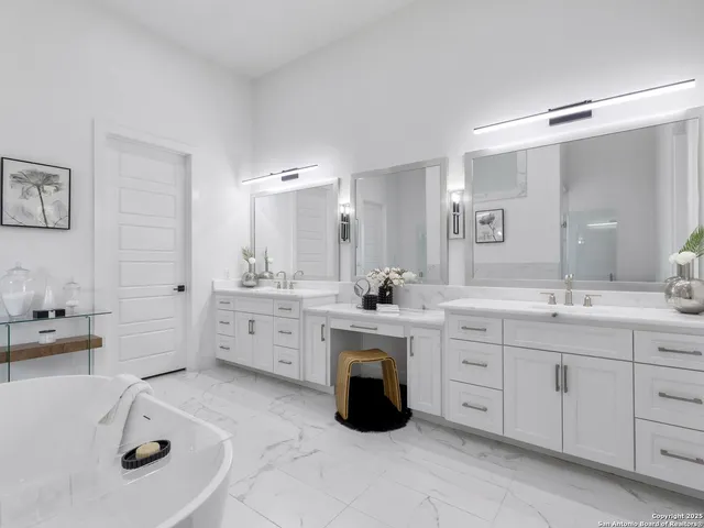 a large bathroom with a double vanity sink a mirror and shower