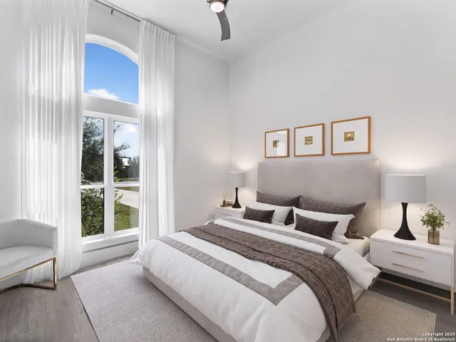 a bedroom with a large bed and a window