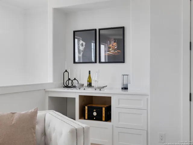 a kitchen with cabinets and a stove