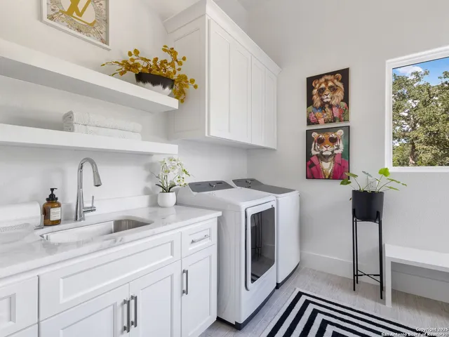 a kitchen with a sink and cabinets