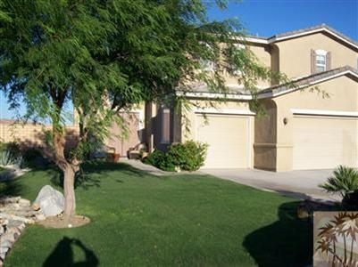37454 Haweswater Road Indio, CA 92203 - Photo 1 of 25 a front view of a house with garden