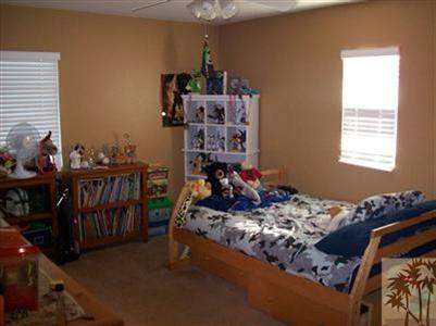37454 Haweswater Road Indio, CA 92203 - Photo 14 of 25 a bed room with bed and a window