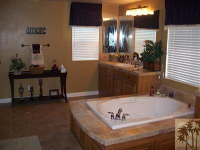 37454 Haweswater Road Indio, CA 92203 - Photo 17 of 25 a bathroom with a sink and a mirror