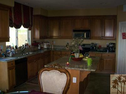 37454 Haweswater Road Indio, CA 92203 - Photo 5 of 25 a kitchen with a sink stove and cabinets
