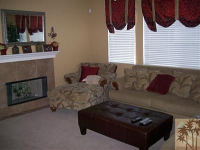 37454 Haweswater Road Indio, CA 92203 - Photo 6 of 25 a living room with furniture and a fireplace