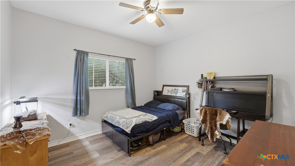 2216 Hornsby Spring Branch, TX 78070 - Photo 22 of 33 a bedroom with furniture and a window