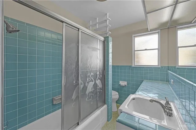 a view of a bathroom from the hallway